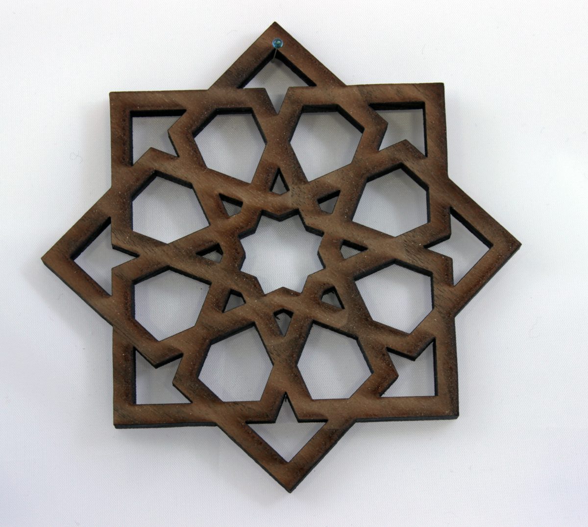 Laser-cut wooden ornament in an eight-pointed Celtic star pattern