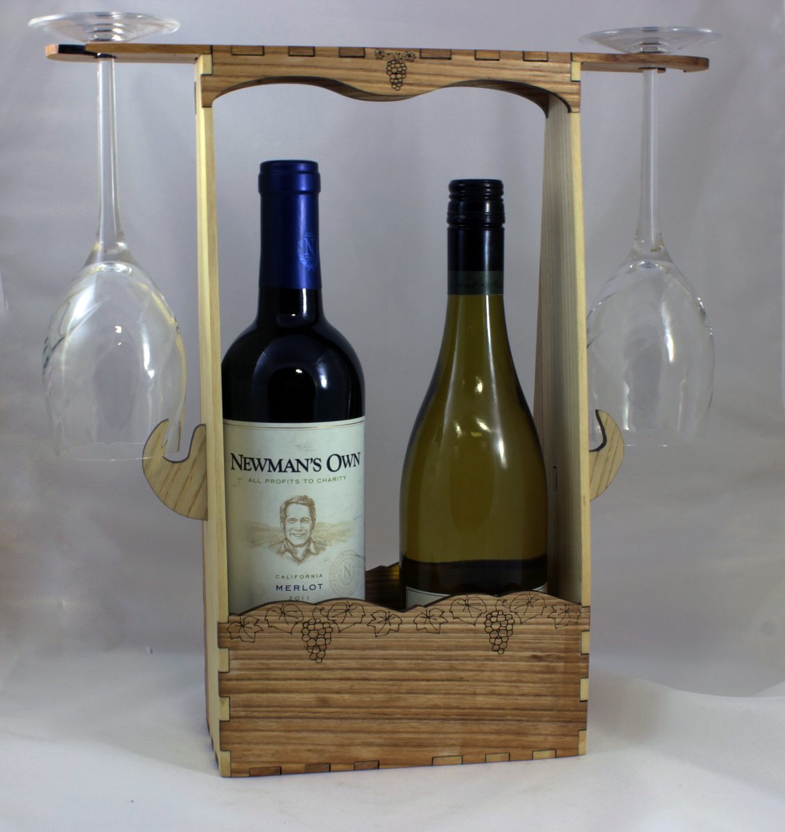 Wooden wine caddy holding two bottles, with a wine glass hanging at each end